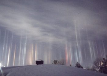 A father captured these stunning images of multicolored pillars beaming down from the sky after waking up at 1.30am and thinking ALIENS were invading. See SWNS story SWLIGHT; Timothy Joseph Elzinga, 33, got out of bed when two-year-old son Gibson started crying - and he noticed the incredible light show outside. He thought someone from Star Wars was ''trying to beam people up'' - and quickly ran outside to investigate the yellow, green, red and blue lights. The amateur photographer captured the incredible light pillars - caused by crystals of moisture frozen in the air - reflecting light over Ontario, Canada, last Friday.