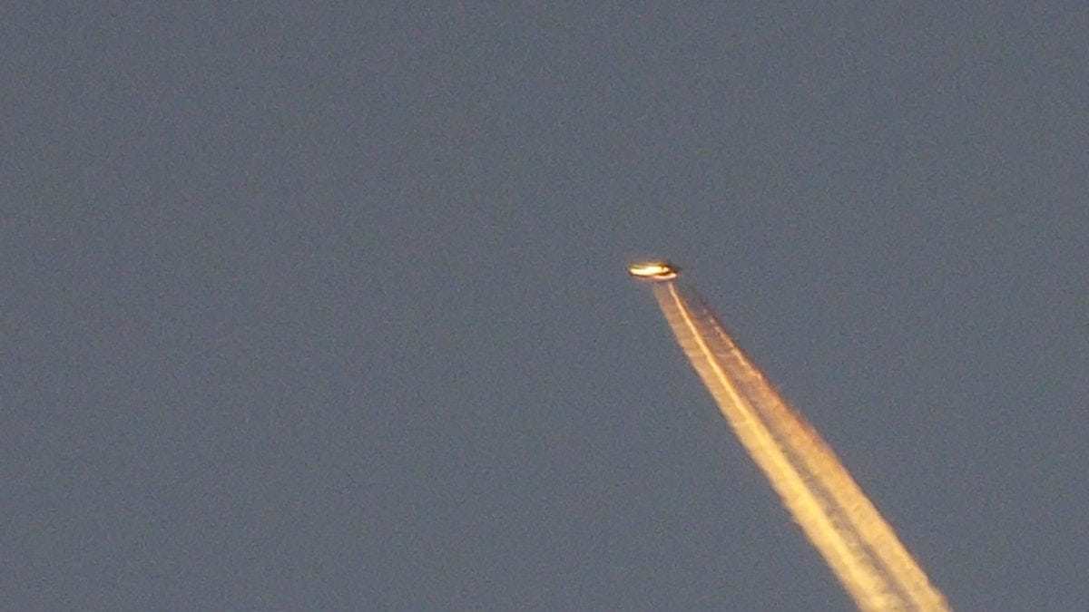 Tyron Osbourne, 52, from Exmouth, Devon, spotted a mystery object above the Devon town, from his garden. See SWNS story SWUFO; Tyron Osborne, 52, of Brixington, was sitting at home on a day off work when he saw what appeared to be a shooting star. This prompted him to grab his camera and tripod and capture the moment that possibly saw an alien flyover. Dominoes Pizza worker Tyron admitted he was a UFO sceptic until the moment he saw what appears to be a flying saucer travelling towards Lympstone. He said: “I noticed a star on the horizon and as soon as the sun went down the star started moving at a pace.