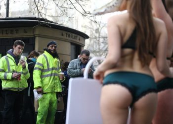 A trio of nearly naked models – dressed in little more than lingerie and crocodile masks – crash the first day of London Fashion Week, brandishing signs proclaiming, "Cruelty to Crocodiles Unmasked" and "Animals Die for Exotic Skins", February 17 2017. See National News story. The action follows a recent PETA exposé of crocodile farms in Vietnam – including two that have supplied skins to a tannery owned by Louis Vuitton's parent company, LVMH – which revealed that the animals are confined to tiny pits and sometimes hacked apart while they're still alive and thrashing.