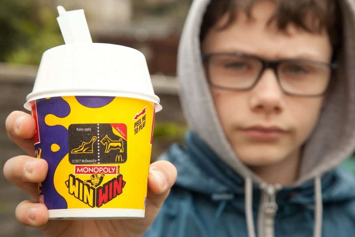 AJ Reeves aged 13 from Worcester. A mum slammed McDonald's for refusing her 13-year-old son a free ice cream prize - because of GAMBLING laws. See NTI story NTIMACCIES. Teenager AJ Reeves peeled off a voucher for a £1 McFlurry on his Monopoly Prize Choice wrapper after buying a Big Mac last Thursday (23/3). He returned to the fast-food resturant in Blackpole, Worcester, that evening to claim the prize but was left devastated when staff told him he was "too young". McDonald's say only customers aged 16 and over can play the game despite it being advertised on every product apart from their Happy Meals. AJ, who suffers from Asperger's syndrome and anxiety, said: "I felt sad and disappointed. I'm not sure whether I will go back."