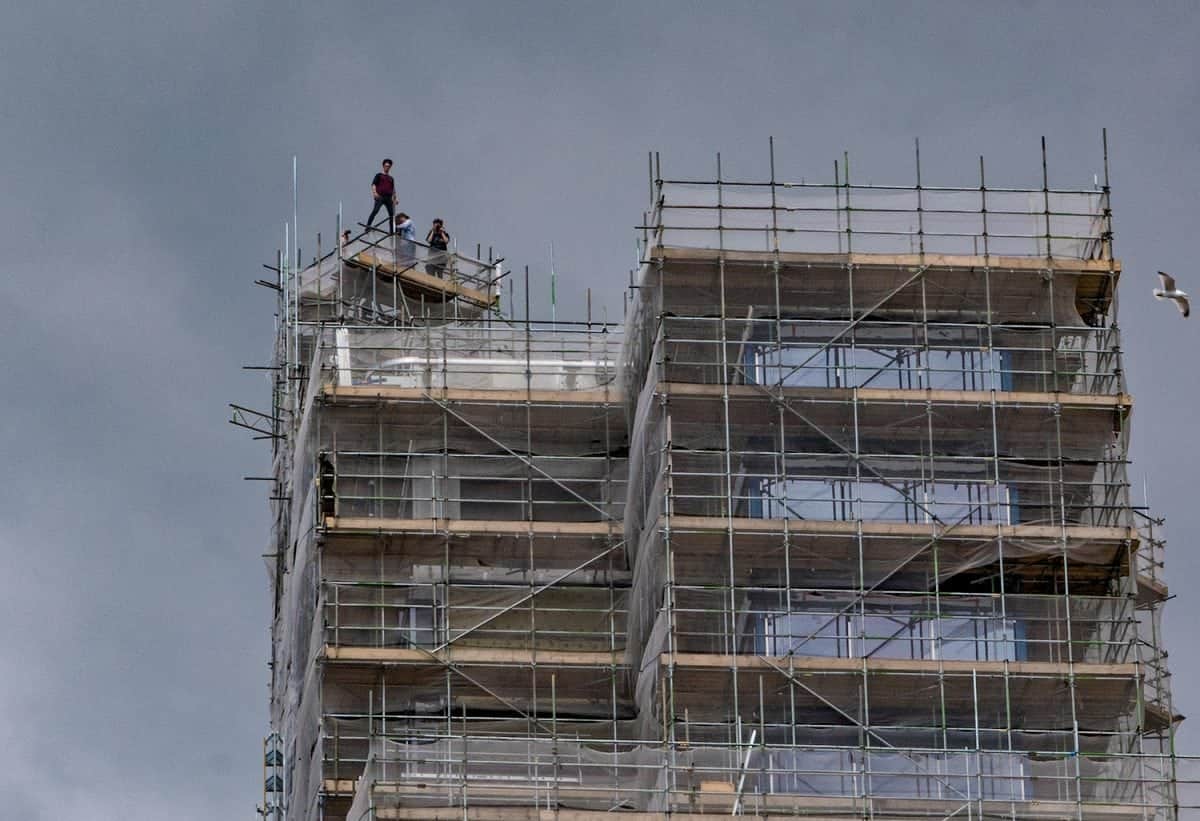 One of the astonishing pictures of youths who had scaled one of the tallest buildings in the south west and were seen posing pricariously at the top. See SWNS story SWSTUNT; A group of young people have scaled one of the tallest buildings in the South West, which is currently under construction. The 22-storey, 78m-high (256ft), Beckley Point building in Plymouth, is due to be occupied by university students from September. It is unclear whether the group was "rooftopping" - climbing to the top of structures to take photographs. Devon and Cornwall Police said it was aware of the incident.