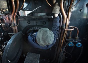 Nick Battle climbs in to the firebox on the Flying Scotsman. See SWNS story SWTRAIN; Flying Scotsman at St Philips Marsh depot, Bristol. Flying Scotsman was originally built in Doncaster for the London and North Eastern Railway (LNER), emerging from the works on 24 February 1923 and initially numbered 1472. It was designed by Sir Nigel Gresley as part of the A1 class – the most powerful locomotives used by the railway. Discover more about Scotsman.