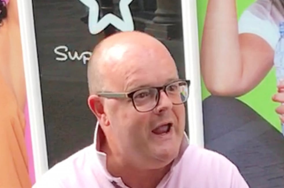 Neil Hotchkiss in a picture taken during the rant in Worcester city centre. A racist middle-aged yob has been fined for shouting abuse at a group of Muslims in the street - and asking them if they were "planning a terrorist attack". See NTI story NTIRANT. Neil Hotchkiss, 44, shocked passersby when he ranted at a businessman and his friends for seven minutes last Friday (7/7). Street vendor, Selasie Clarke, 42, captured bald-headed Hotchkiss on camera and posted pictures of him on Facebook and contacted police. Hotchkiss was arrested and on Monday (10/7) he appeared at Worcester Magistrates' Court where he admitted two counts of acting in a way likely to cause harassment, alarm or distress, which was religiously aggravated. Hotchkiss, of Worcester, was handed a community order for 12 months and ordered to wear an electronic monitoring tag until October. He was also ordered to pay two lots of £50 compensation, an £85 victim surcharge and £180 costs.