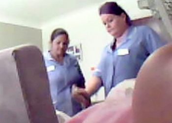 Video grab of a carer Susan Draper captured on film appearing to spray deodorant in Betty Boylan's face and joking it is "better than poo" when a colleague said it went in her mouth. Carer Susan Draper is appearing at Birmingham Magistrates Court today, July 10, 2017.  See NTI story NTIABUSE.   Betty Boylan's relatives hid the device inside a television after they found unexplained bruising on the retired nurse when they visited her at the £1,000-a-month care home.  Within days they uncovered disturbing footage of carer Bina Begum, 49, lifting the great-gran by her head before throwing her back into her chair.  The force of Begum's attack was so hard Betty's chair was seen to rock backwards before her head slumped to the side.  On another occassion, another carer was caught on film spraying deodorant in Betty's face and joking it is "better than poo" when a colleague said it went in her mouth.  Betty's relatives went to the police after recording the footage at the Bupa-run Perry Locks Care Home in Birmingham in September last year.