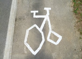 Bungling council workers have been slammed after this terrible image of a bike "looking more like a penny-farthing" was painted on a cycle lane.  See NTI story NTICYCLE.  Residents living in Sleaford, Lincs., were left scratching their heads after the wonky  markings appeared on the pavement over the weekend.  Locals said the cycle path looked like the "scrawlings of a child" while others compared it to a 19th Century penny-farthing bicycle.  Red-faced bosses at Lincolnshire County Council are now having to replace the image on London Road with the correct template.  Retired HR manager Paula Brown, 61, who lives nearby, said she found the gaffe "hilarious" but was angry it would probably cost taxpayers' cash to rectify.