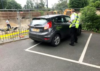 Baffled residents were left outraged after a parking warden left his car carelessly across half a bay - and say he should have given himself a ticket.  See NATIONAL story NNPARK.  A picture snapped by local Steven Way shows the enforcement officer's shoddy parking outside the white lines, although not obstructing other cars.  The grey 17-plate Ford Fiesta, driven by a Shepway District Council warden, was spotted in Hythe, Kent, on Monday morning.  Steven, a chartered building surveyor, stressed that the officer "shouldn't need to be told" how to park correctly in the bay.