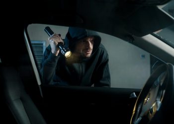 Theif stealing car