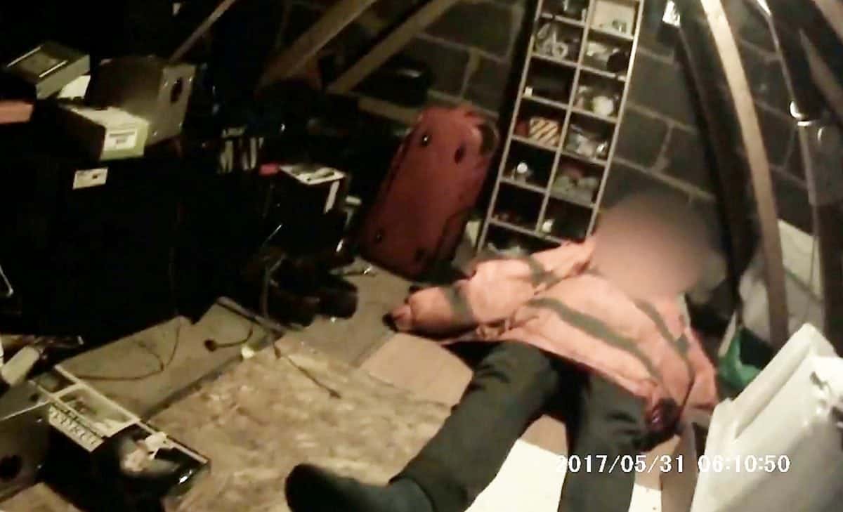 Video grab of the discovery of a victim sleeping on the floor of the loft, using a jacket as a blanket. A 42-year-old man has today been jailed for 40 months for two modern slavery offences. See NTI story NTISLAVE. Edward Zielinski of Hyson Green, Nottingham, exploited two vulnerable Polish nationals, using violence to control their ID documents and forcing them to work for little or no money. Zielinski would even lock his victims in the loft during the night forcing them to urinate in plastic bottles rather than wake him and his wife. Despite earning around £300 a week one of the slaves was only paid with cigarettes, alcohol, the occasional piece of clothing from a car boot sale and £10 in cash.