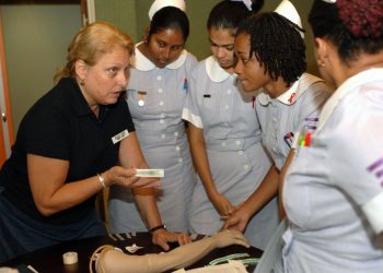 070918-N-7088A-100 
CHAMPS FLEURS, Trinidad and Tobago (Sept. 18, 2007) - Genie Lindsey, a registered nurse with Project Hope attached to Military Sealift Command hospital ship USNS Comfort (T-AH 20), explains the correct procedures for administering an intravenous tube to nursing students at the Eric Williams Medical Science Complex. Comfort is on a four-month humanitarian deployment to Latin America and the Caribbean providing medical treatment to patients in a dozen countries. U.S. Navy photo by Mass Communication Specialist 2nd Class Elizabeth R. Allen (RELEASED)