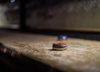 A disc of a deck shuffleboard.