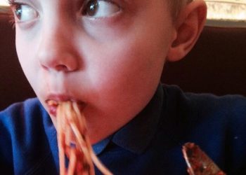 eating spaghetti food