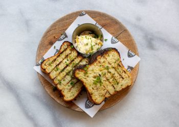 Caravan's Jalapeño cornbread, chipotle butter, coriander, lime Caravan