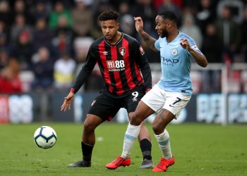 Bournemouth's Lys Mousset (left) and Manchester City's Raheem Sterling battle for the ball during the Premier League match at the Vitality Stadium, Bournemouth.