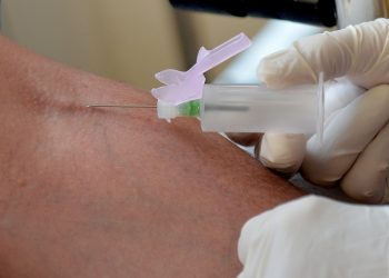 A nurse takes blood at the Temple Fortune Health Centre GP Practice near Golders Green, London.