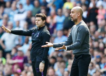 Tottenham Hotspur manager Mauricio Pochettino (left) and Manchester City manager Pep Guardiola on the touchline during the Premier League match at the Etihad Stadium, Manchester.