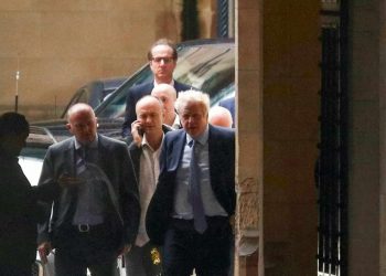Boris Johnson and Dominic Cummings are seen outside Parliament as the embattled PM is set to address MPs, September 25 2019.