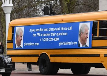A yellow school bus with a post-birthday message for the Duke of York, from US lawyer Gloria Allred, driving along The Mall towards Buckingham Palace, London. Ms Allred, who represents five of the victims of Jeffrey Epstein, has been critical of the Duke for not speaking with the FBI about his former friend Epstein.