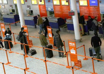 Members of the public wait for flights and transfers at Bristol International Airport as flights are expected to begin arriving again this morning. Credit;PA