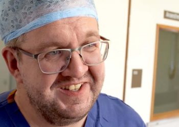 photo of Vascular surgeon Neil Hopper, 43, who had a below-the-knee double amputation after falling ill with sepsis.