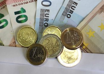 Stock picture of euro notes and coins.