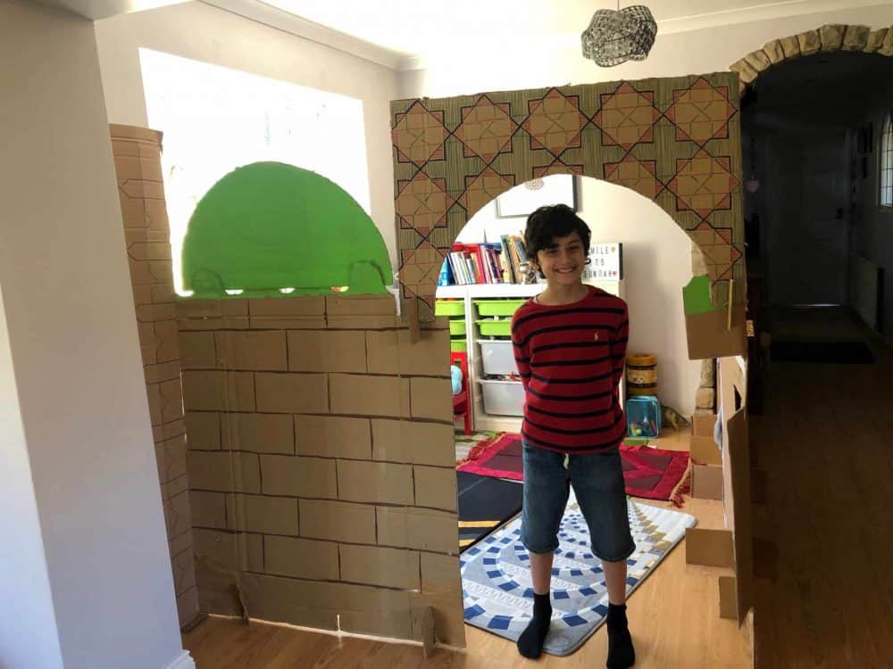 Yahya Murad Hussain with his homemade mosque. Credit;SWNS