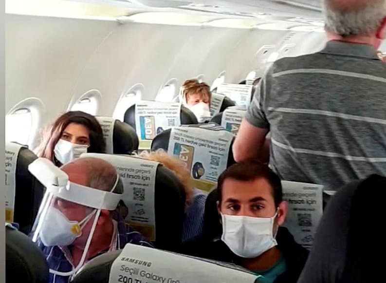 Video grab from a ''crowded'' repatriation flight from Turkey to the UK on April 28 Credit;SWNS