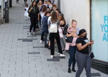 Shoppers queue outside Primark in Bristol on the first day that non essential shops are allowed to opening following coronavirus restrictions, June 15 2020. Credit;SWNS