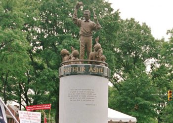 A crowd gathers at the base of the Arthur Ashe Monument after the ceremony dedicating the statue on Monument Avenue in Richmond, Va., Wednesday, July 10, 1996. (AP Photo/Steve Helber)