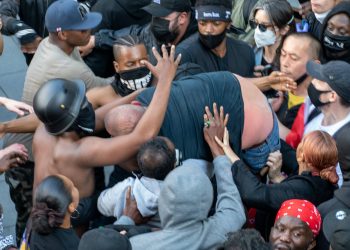 Dramatic photos reveal the melee during the Black Lives Matter protest which led to Patrick Hutchinson and a group of fellow demonstrators saving a white man from the far right racist counter protest after he got into trouble, Waterloo Station, London 13 June 2020. Credit: SWNS
