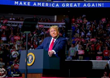 One of the pictures made by D’ante Speed before he was turned out of a Trump campaign rally. See SWNS story SWSYrally. A black photographer claimed he was thrown out of President Trump’s campaign rally and threatened with arrest despite repeatedly showing his press pass. D’ante Speed, 24, filmed cops escorting him out of the political event at the BOK center in Tulsa, Ohio, on Saturday [June 20] as the national guard stood by. The freelance photographer alleged that a police officer threatened to arrest him if D’ante recorded the interaction and even reached for his gun. D’ante believed that he was ejected from the rally because he was black and a member of the press. Credit;SWNS
