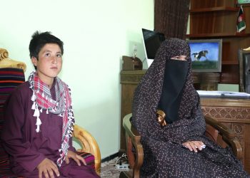 Qamar Gul, 16, right, and her brother Habibullah, 12, left, poses for photograph in the governor house of Ghor province western of Afghanistan, Tuesday, July 21, 2020. A 16-year old Afghan girl who killed Taliban who attacked and killed her parents in western Ghor province has become a local hero. (AP Photo)
