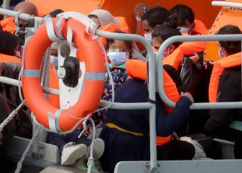 NOTE: FACES HAVE BEEN PIXELATED BY THE PA PICTURE DESK TO PROTECT IDENTITY OF ANY MINORS PRESENT A group of people thought to be migrants are brought into Dover, Kent, onboard the Dover RNLI lifeboat following a number of small boat incidents in the Channel earlier today.