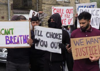 People with placards, gathered for a demonstration outside Halifax police station on Wednesday afternoon. A West Yorkshire officer has been suspended after a video was widely shared of Hassan Ahmed, 27, being arrested in Halifax on Sunday. Safyah is Hassan Ahmed's sister.Credit;PA