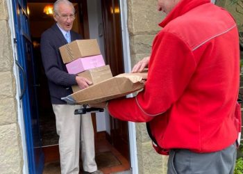 Tommy Houston with some of the 400 cards he received for his 95th birthday. Credit;SWNS