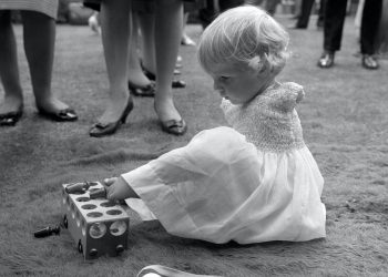 Phillipa Bradbourne, a baby born without arms as a result of Thalidomide, at a party in the 1960s (PA)