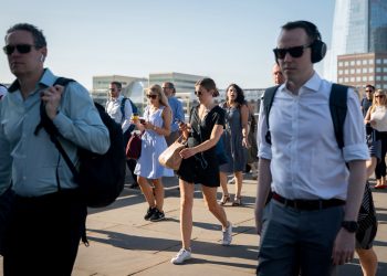 Commuters cross London Bridge, London, Credit;SWNS