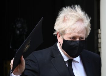 Prime Minister Boris Johnson, who appears to have had a haircut on the first day of the easing of lockdown restrictions in England, leaving 10 Downing Street in Westminster heading for the Houses of Parliament. Picture date: Monday April 12, 2021.