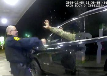 In this image made from Windsor, (Va.) Police video, A police officer uses a spray agent on Caron Nazario on Dec. 20, 2020, in Windsor, Va. Nazario, a second lieutenant in the U.S. Army, is suing two Virginia police officers over a traffic stop during which he says the officers drew their guns and pointed them at him as he was dressed in uniform. Caron Nazario says his constitutional rights were violated by the traffic stop in the town of Windsor in December. (Windsor Police via AP)