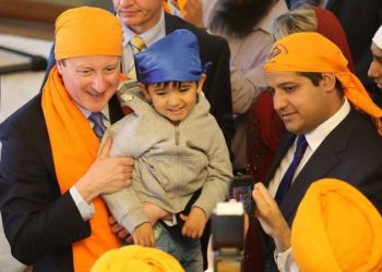 Samir Jassal (right) with David Cameron on a visit to a Sikh place of worship in Kent, 2015