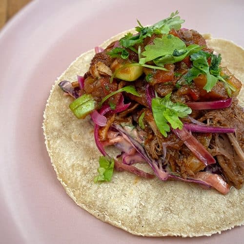 Pork tacos with brown sauce salsa