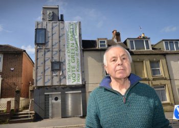 Ken Davis and his Zero carbon house in Bohemia Road, Hastings. See SWNS story SWNNeco. A green homeowner who is building the first zero carbon house in the area has been ordered to remove a storey of the renovation by the council.  Ken Davis is doing up a house in St Leonards, East Sussex, to make it the borough’s first zero carbon home. But the project has been delayed after the local council asked him to get rid one storey of the building after an application to extend and alter the property was refused.