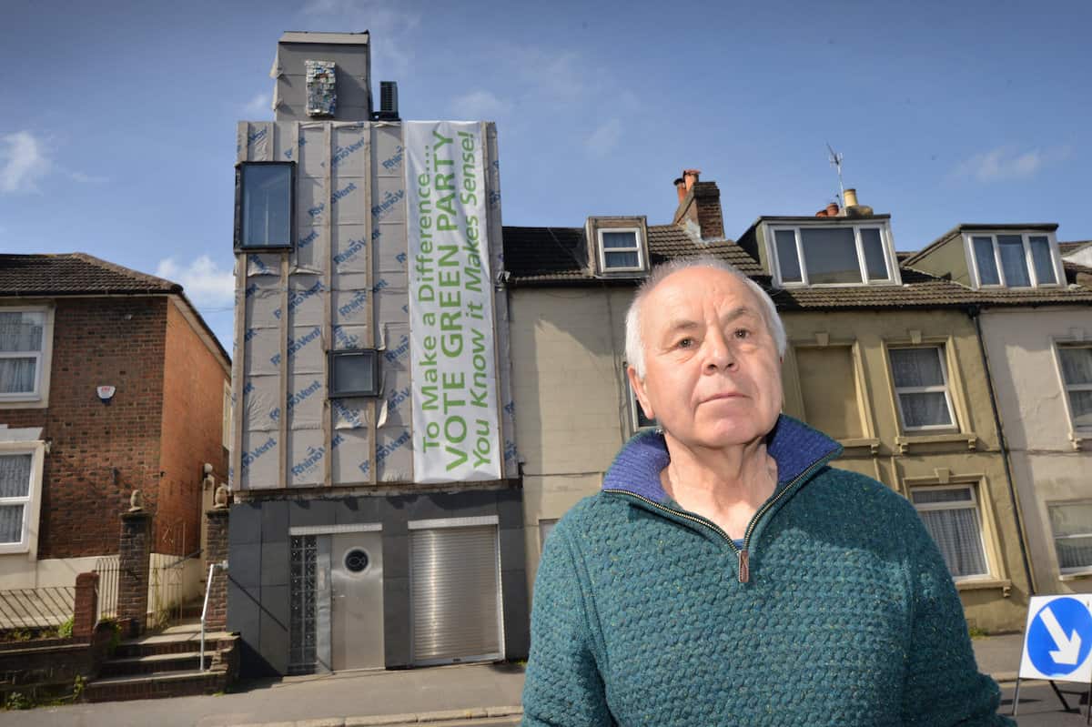 Ken Davis and his Zero carbon house in Bohemia Road, Hastings. See SWNS story SWNNeco. A green homeowner who is building the first zero carbon house in the area has been ordered to remove a storey of the renovation by the council. Ken Davis is doing up a house in St Leonards, East Sussex, to make it the borough’s first zero carbon home. But the project has been delayed after the local council asked him to get rid one storey of the building after an application to extend and alter the property was refused.