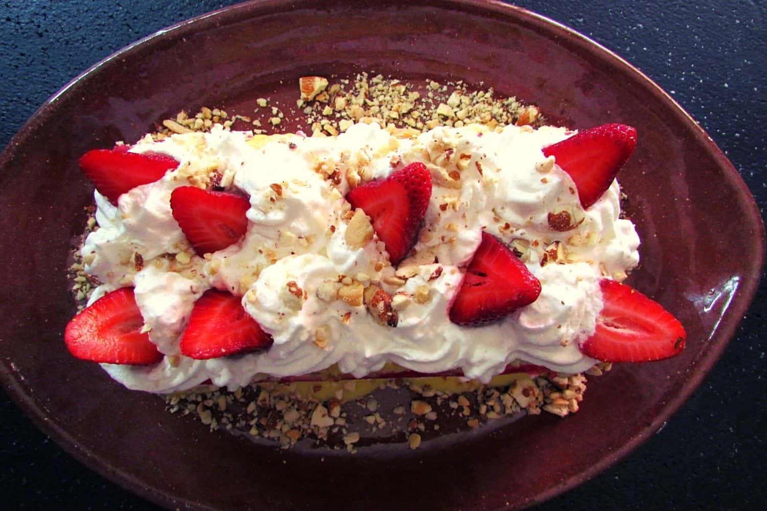 Trifle Loaf with a Swiss Roll, Strawberries and Pecan Nuts