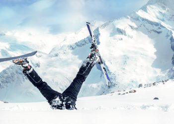 Newbie skier stuck  in deep snow with his legs upside down