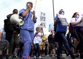 Health workers march to Downing Street, London. Credit;PA