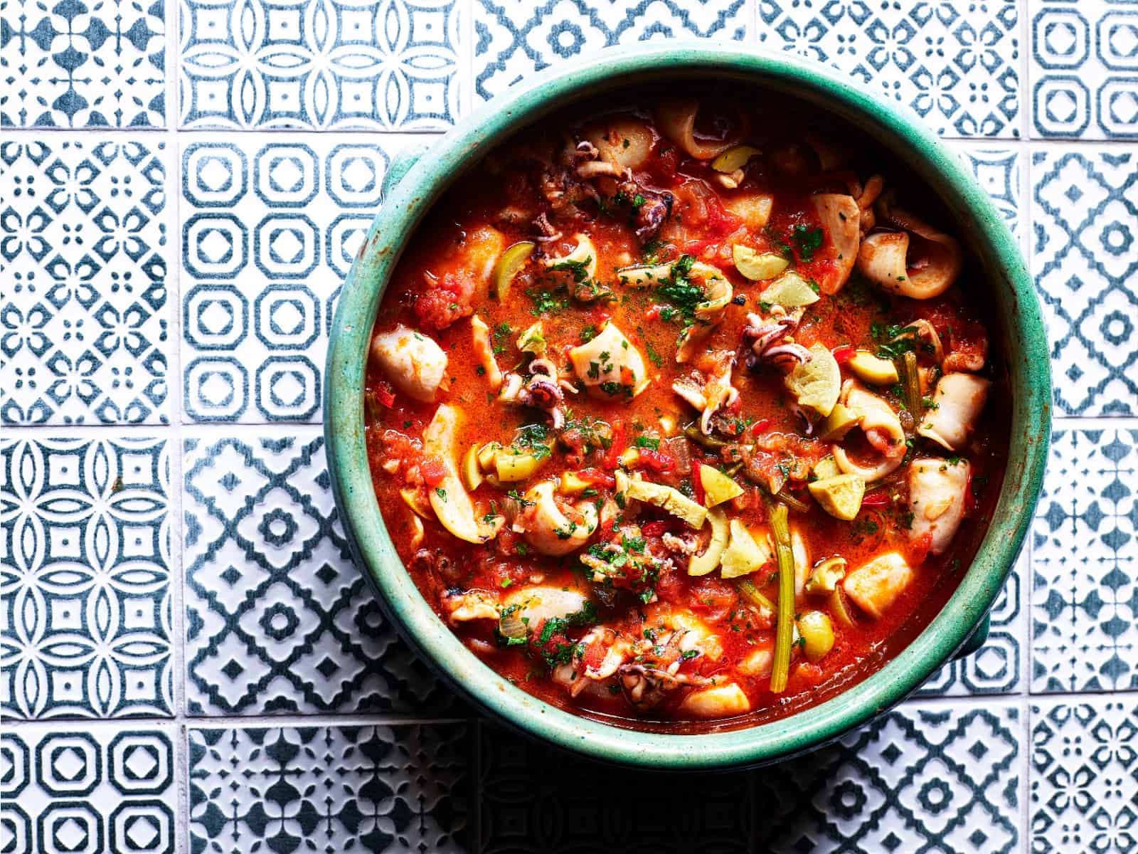 Slow-cooked squid, olives & preserved lemons recipe by Ben Tish
