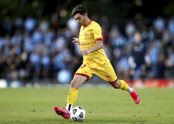 Josh Cavallo of the Adelaide United controls the ball during an A-League match between Sydney FC and Adelaide United in Sydney, on April 18, 2021. Cavallo came out in a series of social media posts and made comments about his experience in a video released Wednesday, Oct. 27, 2021, by his A-League club. Cavallo says he's the first active male player in the A-League to come out as gay. (Brendon Thorne/AAP Image via AP)