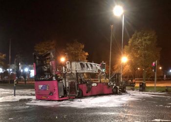 The burnt out double decker bus in Church Road near Rathcoole in Newtownabbey, Co Antrim after it was hijacked and set on fire near a loyalist estate on the outskirts of Belfast. Picture date: Sunday November 7, 2021.