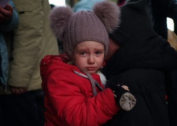 A young Ukrainian refugee cries on the shoulder of her mother in the entrance hall at Przemysl Glowny train station in Poland, after arriving by train from Ukraine to flee the Russian invasion. Picture date: Tuesday March 29, 2022.