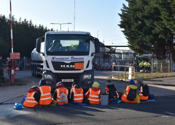 Activists from Just Stop Oil during one of their blockades at the Esso depot in Wood Lane, Birmingham early on Friday. Credit:PA